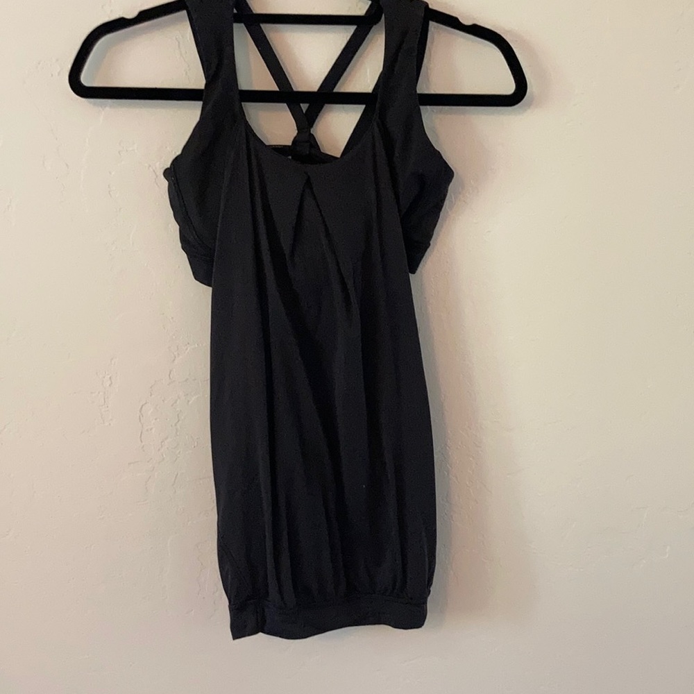 A Lululemon workout shirt. With a built-in bra. And open back. Size 6